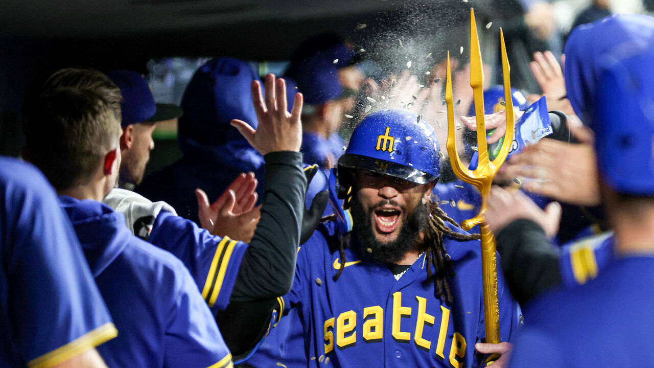 SEATTLE, WASHINGTON - SEPTEMBER 29: J.P. Crawford #3 of the Seattle Mariners reacts after his grand slam with the trident during the fourth inning against the Texas Rangers at T-Mobile Park on September 29, 2023 in Seattle, Washington.