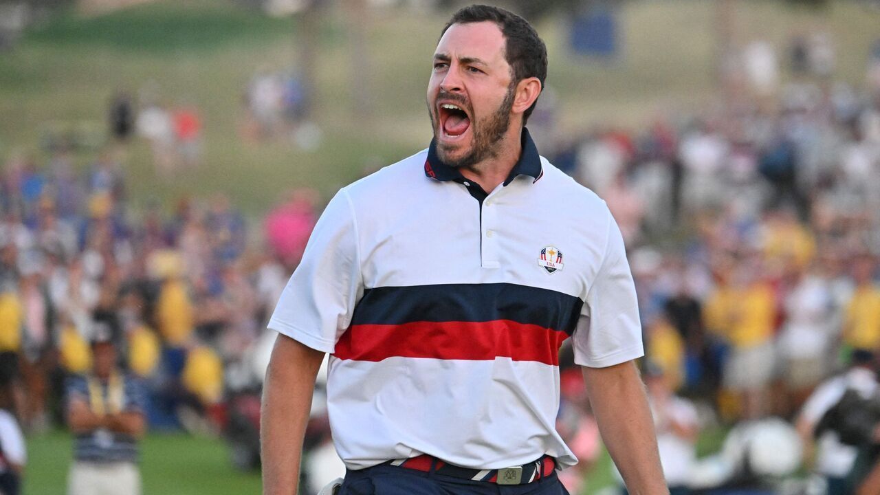 US golfer, Patrick Cantlay celebrates after holing his birdie putt to win the hole and the match on the 18th green during his four-ball match with US golfer, Wyndham Clark against Europe's Northern Irish golfer, Rory McIlroy and Europe's English golfer, Matt Fitzpatrick on the second day of play in the 44th Ryder Cup at the Marco Simone Golf and Country Club in Rome on September 30, 2023.