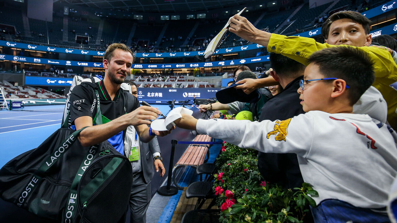 BEIJING, CHINA - SEPTEMBER 30: Daniil Medvedev of Russia signs autographs for fans after the Men's Singles Round of 16 match against Alex De Minaur of Australia on day five of 2023 China Open at the National Tennis Center on September 30, 2023 in Beijing, China.