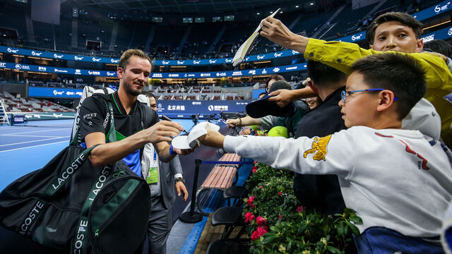 BEIJING, CHINA - SEPTEMBER 30: Daniil Medvedev of Russia signs autographs for fans after the Men's Singles Round of 16 match against Alex De Minaur of Australia on day five of 2023 China Open at the National Tennis Center on September 30, 2023 in Beijing, China.