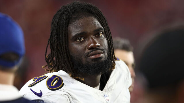 TAMPA, FL - AUGUST 26: David Ojabo #90 of the Baltimore Ravens stands on the sidelines during an NFL preseason football game against the Tampa Bay Buccaneers at Raymond James Stadium on August 26, 2023 in Tampa, Florida.