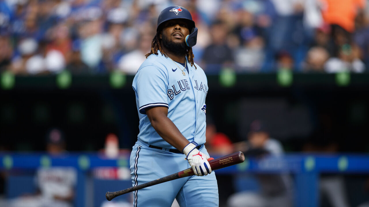 TORONTO, ON - AUGUST 13: Vladimir Guerrero Jr. #27 of the Toronto Blue Jays walks to the dugout after his at bat during their MLB game against the Cleveland Guardians at Rogers Centre on August 13, 2022 in Toronto, Canada.