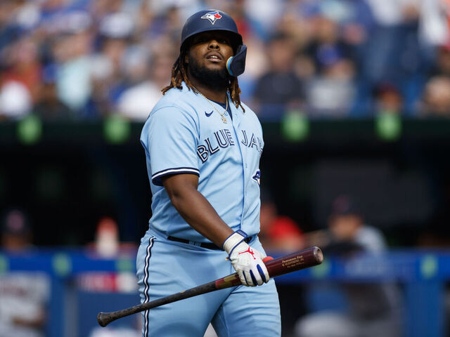 TORONTO, ON - AUGUST 13: Vladimir Guerrero Jr. #27 of the Toronto Blue Jays walks to the dugout after his at bat during their MLB game against the Cleveland Guardians at Rogers Centre on August 13, 2022 in Toronto, Canada.