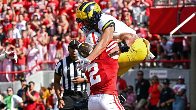 LINCOLN, NEBRASKA - SEPTEMBER 30: Roman Wilson (R) #1 of the Michigan Wolverines catches a touchdown pass against Isaac Gifford #2 of the Nebraska Cornhuskers in the first quarter at Memorial Stadium on September 30, 2023 in Lincoln, Nebraska.