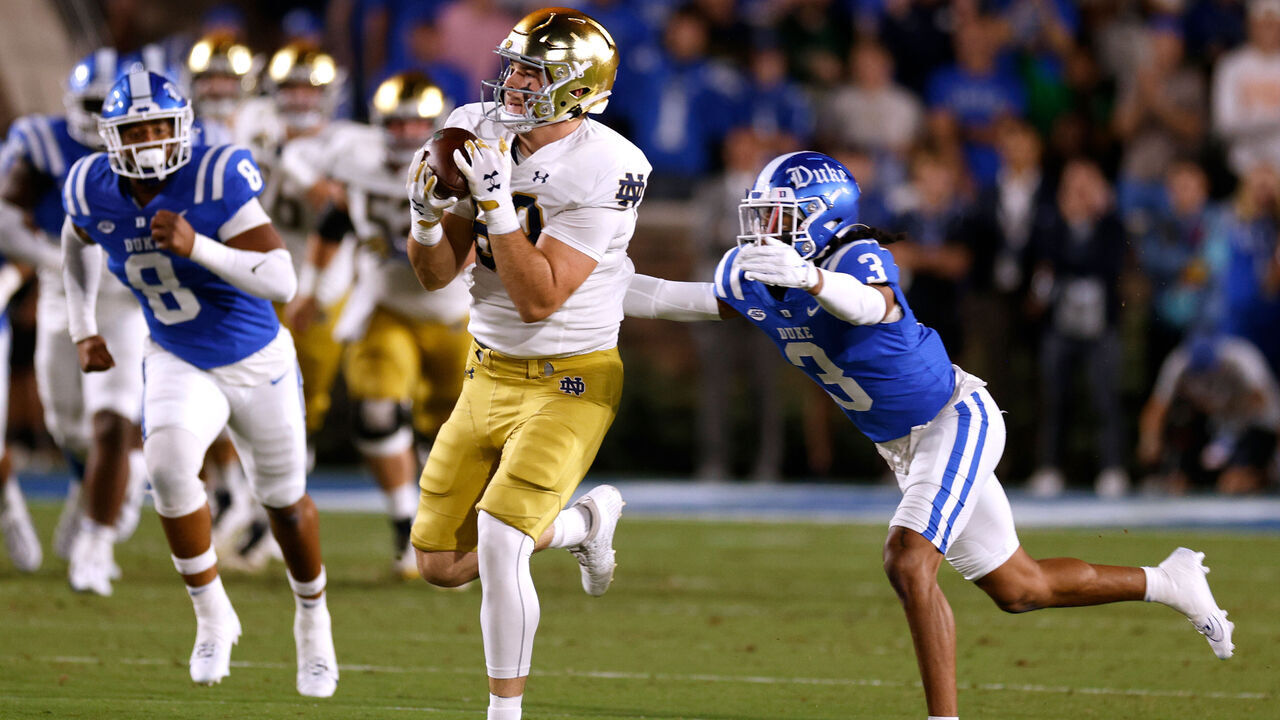 DURHAM, NORTH CAROLINA - SEPTEMBER 30: Mitchell Evans #88 of the Notre Dame Fighting Irish makes a catch against Brandon Johnson #3 of the Duke Blue Devils during the first half at Wallace Wade Stadium on September 30, 2023 in Durham, North Carolina.
