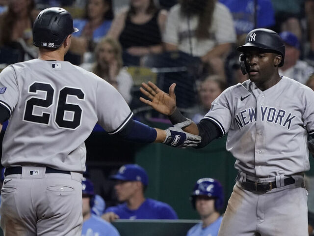 Estevan Florial of the New York Yankees celebrates in the dugout