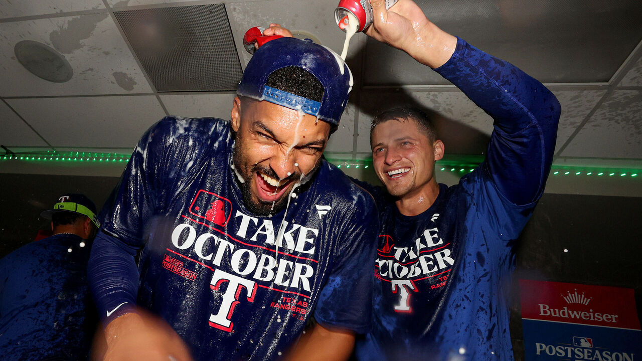 SEATTLE, WASHINGTON - SEPTEMBER 30: Marcus Semien #2 and Corey Seager #5 of the Texas Rangers celebrate in the clubhouse after the Texas Rangers clinched a 2023 MLB playoff berth Mariners at T-Mobile Park on September 30, 2023 in Seattle, Washington.