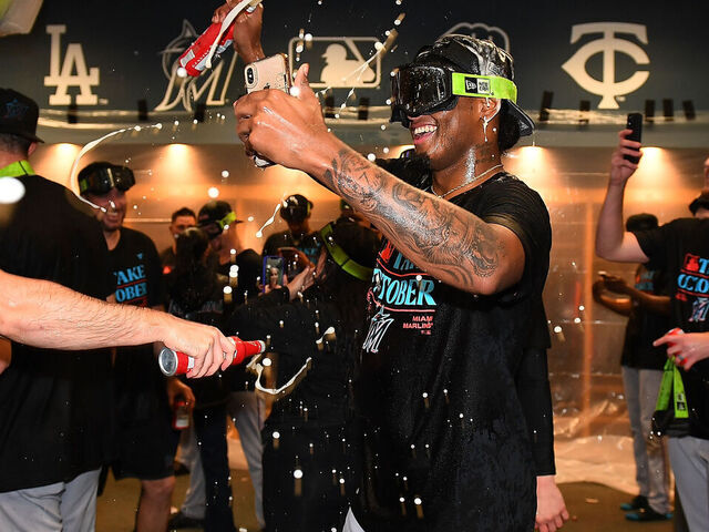 Marlins clinch playoff spot with 7-3 win over Pirates