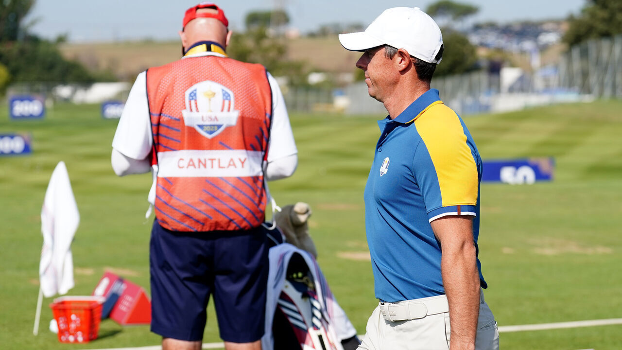 Team Europe's Rory McIlroy walks past Joe LaCava, caddie for USA's Patrick Cantlay on day three of the 44th Ryder Cup at the Marco Simone Golf and Country Club, Rome, Italy. Picture date: Sunday October 1, 2023.