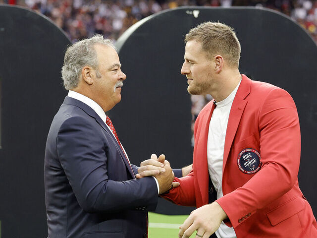 HOUSTON, TEXAS - OCTOBER 01: Houston Texans CEO Cal McNair shakes hands with former player J.J. Watt during a ceremony inducting Watt into the Texans Ring of Honor during a game against the Pittsburgh Steelers at NRG Stadium on October 01, 2023 in Houston, Texas.