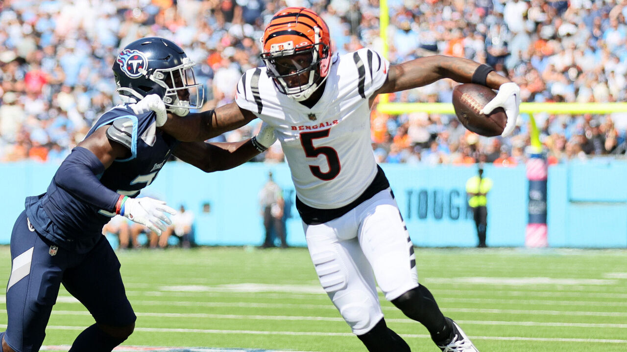 NASHVILLE, TENNESSEE - OCTOBER 01: Tee Higgins #5 of the Cincinnati Bengals runs against Roger McCreary #21 of the Tennessee Titans during the first quarter at Nissan Stadium on October 01, 2023 in Nashville, Tennessee.