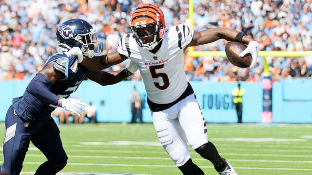 NASHVILLE, TENNESSEE - OCTOBER 01: Tee Higgins #5 of the Cincinnati Bengals runs against Roger McCreary #21 of the Tennessee Titans during the first quarter at Nissan Stadium on October 01, 2023 in Nashville, Tennessee.