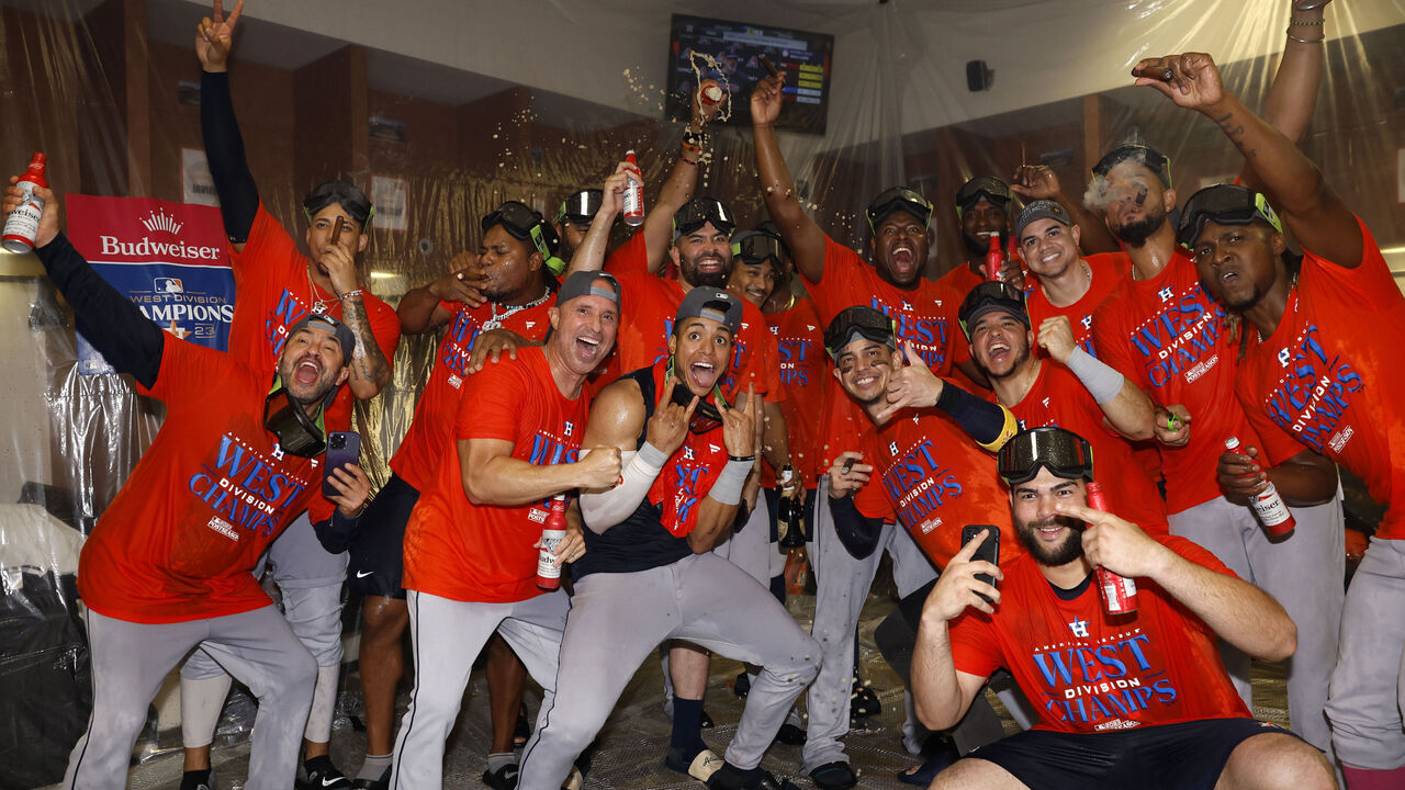 PHOENIX, ARIZONA - OCTOBER 01: Houston Astros players pose for a photo after defeating the Arizona Diamondbacks 8-1 to win the American League West division title at Chase Field on October 01, 2023 in Phoenix, Arizona.