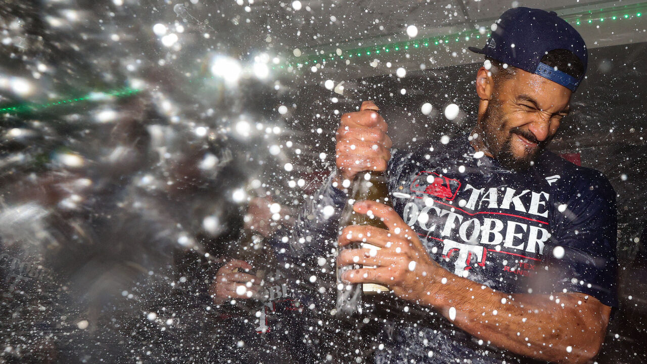 SEATTLE, WASHINGTON - SEPTEMBER 30: Marcus Semien #2 of the Texas Rangers celebrates in the clubhouse after the Texas Rangers clinched a 2023 MLB playoff berth against the Seattle Mariners at T-Mobile Park on September 30, 2023 in Seattle, Washington.
