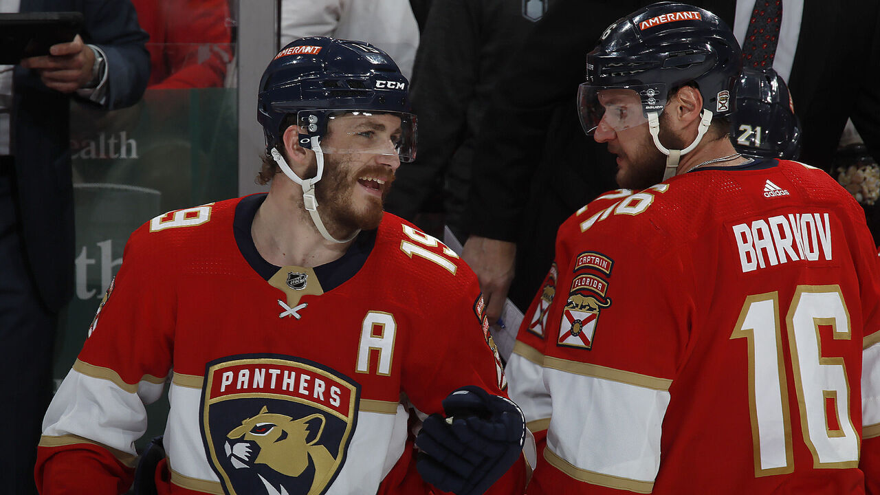 SUNRISE, FLORIDA - MAY 24: Matthew Tkachuk #19 and Aleksander Barkov #16 of the Florida Panthers share a few words during a break in the action against the Carolina Hurricanes in Game Four of the Eastern Conference Final of the 2023 Stanley Cup Playoffs at the FLA Live Arena on May 24, 2023 in Sunrise, Florida.