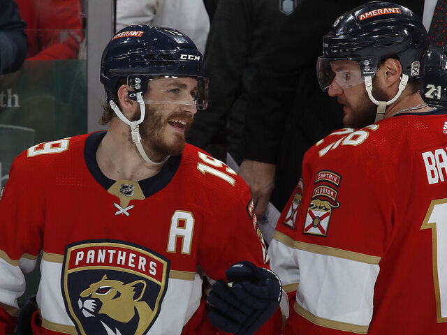 SUNRISE, FLORIDA - MAY 24: Matthew Tkachuk #19 and Aleksander Barkov #16 of the Florida Panthers share a few words during a break in the action against the Carolina Hurricanes in Game Four of the Eastern Conference Final of the 2023 Stanley Cup Playoffs at the FLA Live Arena on May 24, 2023 in Sunrise, Florida.