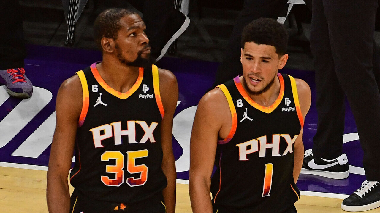 PHOENIX, AZ - MAY 11: Devin Booker #1 and Kevin Durant #35 of the Phoenix Suns look on during Game 6 of the 2023 NBA Playoffs Western Conference semi-finals against the Denver Nuggets on May 11, 2023 at Footprint Center in Phoenix, Arizona. Mandatory Copyright Notice: Copyright 2023 NBAE