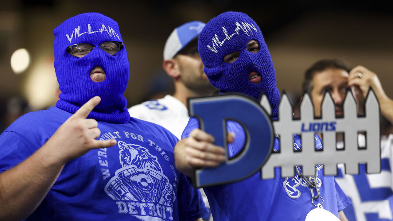 DETROIT, MI - SEPTEMBER 24: Detroit Lions fans wearing ski masks pose for a photo during the fourth quarter of an NFL football game against the Atlanta Falcons at Ford Field on September 24, 2023 in Detroit, Michigan.