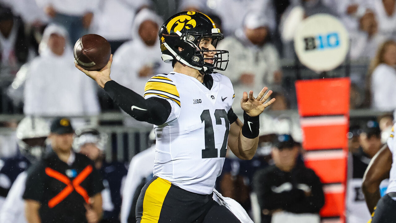 STATE COLLEGE, PA - SEPTEMBER 23: Cade McNamara #12 of the Iowa Hawkeyes attempts a pass against the Penn State Nittany Lions during the first half at Beaver Stadium on September 23, 2023 in State College, Pennsylvania.
