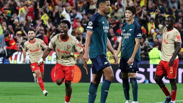 Lens' French forward #09 Elye Wahi (L) celebrates after scoring a goal his team's second goal during the UEFA Champions League Group B first leg football match between RC Lens and Arsenal FC at the Bollaert Stadium in Lens, northern France, on October 3, 2023.