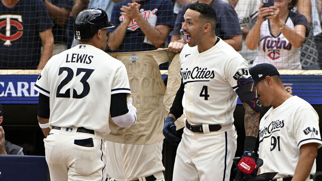 MINNEAPOLIS, MINNESOTA - OCTOBER 03: Royce Lewis #23 of the Minnesota Twins celebrates with Carlos Correa #4 after hitting a solo home run against Kevin Gausman #34 of the Toronto Blue Jays during the third inning in Game One of the Wild Card Series at Target Field on October 03, 2023 in Minneapolis, Minnesota.