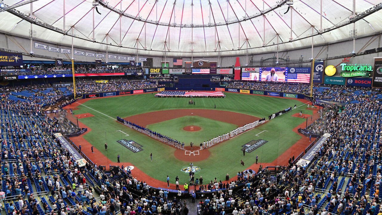 ST PETERSBURG, FLORIDA - OCTOBER 03: The Tampa Bay Rays and the Texas Rangers line up for the national anthem prior to the start of Game One of the Wild Card Series at Tropicana Field on October 03, 2023 in St Petersburg, Florida.