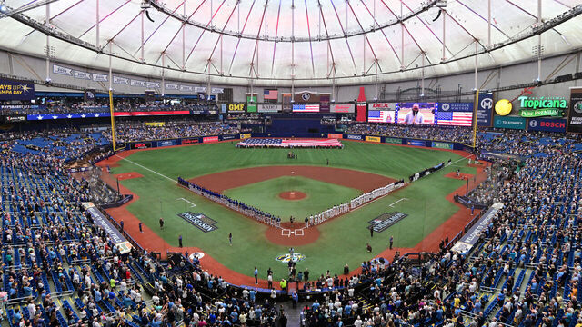 ST PETERSBURG, FLORIDA - OCTOBER 03: The Tampa Bay Rays and the Texas Rangers line up for the national anthem prior to the start of Game One of the Wild Card Series at Tropicana Field on October 03, 2023 in St Petersburg, Florida.