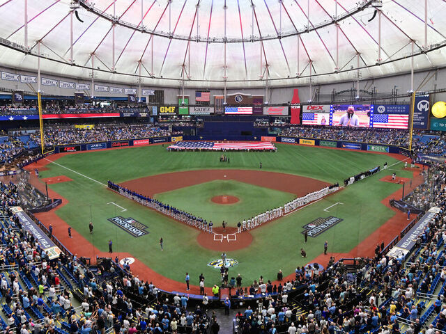 ST PETERSBURG, FLORIDA - OCTOBER 03: The Tampa Bay Rays and the Texas Rangers line up for the national anthem prior to the start of Game One of the Wild Card Series at Tropicana Field on October 03, 2023 in St Petersburg, Florida.
