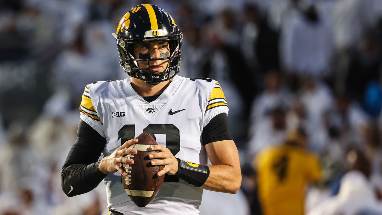STATE COLLEGE, PA - SEPTEMBER 23: Cade McNamara #12 of the Iowa Hawkeyes warms up before the game against the Penn State Nittany Lions at Beaver Stadium on September 23, 2023 in State College, Pennsylvania.