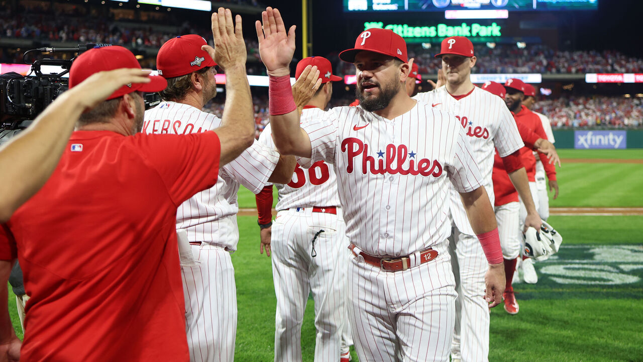 PHILADELPHIA, PA - OCTOBER 03: Kyle Schwarber #12 of the Philadelphia Phillies high-fives teammates after Game 1 of the Wild Card Series between the Miami Marlins and the Philadelphia Phillies at Citizens Bank Park on Tuesday, October 3, 2023 in Philadelphia, Pennsylvania.