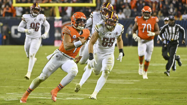 CHICAGO, IL - OCTOBER 13: Chicago Bears quarterback Justin Fields (1) runs for a big gain inside the 10 yard line during the final moment of the game against the Washington Commanders during the game at Soldier Field on October 13, 2022.