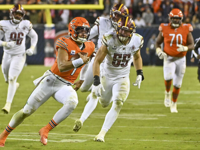 Washington Commanders players stretch out during NFL football