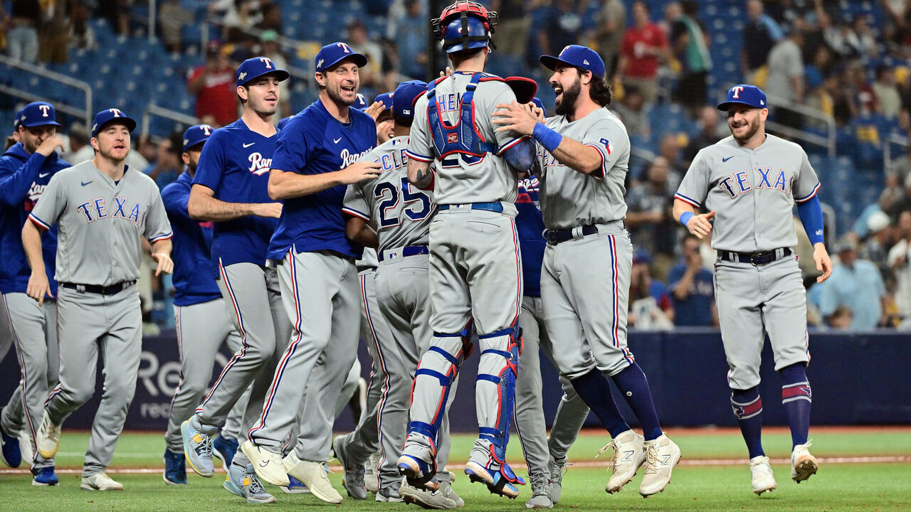 ST PETERSBURG, FLORIDA - OCTOBER 04: The Texas Rangers celebrate after defeating the Tampa Bay Rays 7-1in Game Two of the Wild Card Series at Tropicana Field on October 04, 2023 in St Petersburg, Florida.