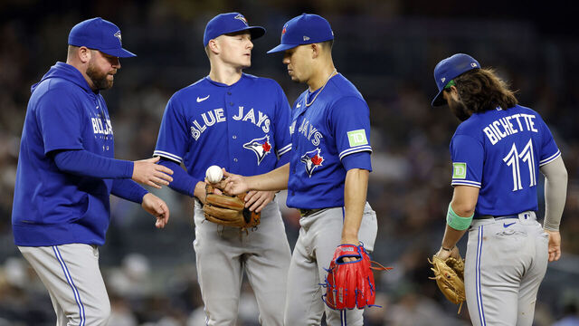 NEW YORK, NEW YORK - SEPTEMBER 21: Manager John Schneider #14 of the Toronto Blue Jays takes Jose Berrios #17 out of the game during the sixth inning of the game against the New York Yankees at Yankee Stadium on September 21, 2023 in the Bronx borough of New York City.
