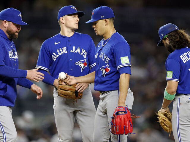 NEW YORK, NEW YORK - SEPTEMBER 21: Manager John Schneider #14 of the Toronto Blue Jays takes Jose Berrios #17 out of the game during the sixth inning of the game against the New York Yankees at Yankee Stadium on September 21, 2023 in the Bronx borough of New York City.