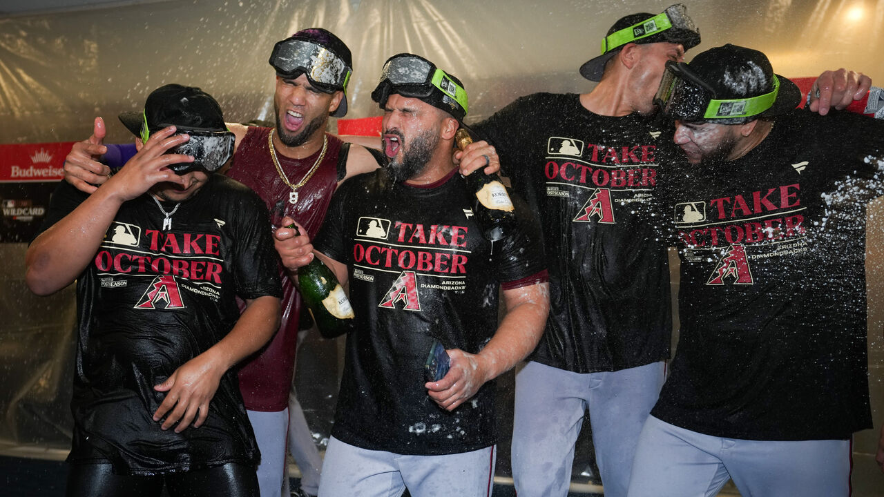 MILWAUKEE, WI - OCTOBER 04: Gabriel Moreno #14, Lourdes Gurriel Jr. #12, Jose Herrera #11 and teammates of the Arizona Diamondbacks celebrate advancing to the NLDS after taking Game 2 of the Wild Card Series between the Arizona Diamondbacks and the Milwaukee Brewers at American Family Field on Wednesday, October 4, 2023 in Milwaukee, Wisconsin.