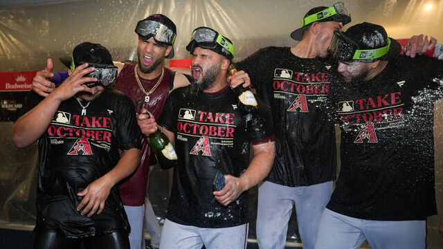 MILWAUKEE, WI - OCTOBER 04: Gabriel Moreno #14, Lourdes Gurriel Jr. #12, Jose Herrera #11 and teammates of the Arizona Diamondbacks celebrate advancing to the NLDS after taking Game 2 of the Wild Card Series between the Arizona Diamondbacks and the Milwaukee Brewers at American Family Field on Wednesday, October 4, 2023 in Milwaukee, Wisconsin.