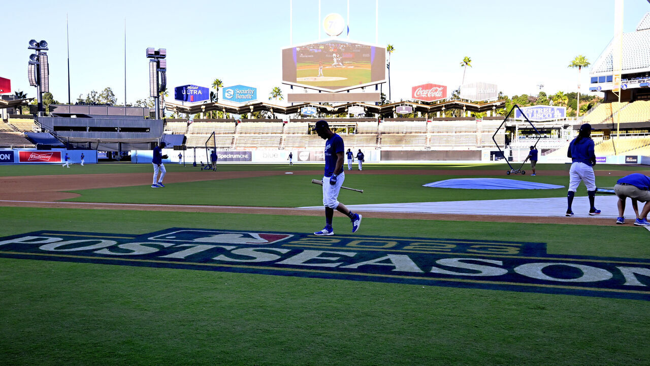 Los Angeles, CA - October 04: Chris Taylor #3 of the Los Angeles Dodgers walks over the Postseason logo during a workout for the upcoming National League Division Series baseball game at Dodger Stadium in Los Angeles on Wednesday, October 4, 2023.