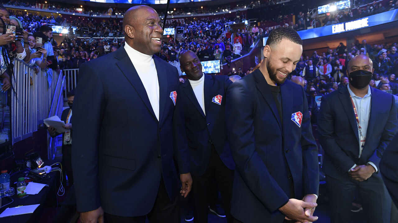 CLEVELAND, OH - FEBRUARY 20: NBA Legends, Magic Johnson, Michael Jordan and Stephen Curry talk during 71st NBA All-Star Game as part of 2022 NBA All Star Weekend on February 20, 2022 at Wolstein Center in Cleveland, Ohio. NOTE TO USER: User expressly acknowledges and agrees that, by downloading and/or using this Photograph, user is consenting to the terms and conditions of the Getty Images License Agreement. Mandatory Copyright Notice: Copyright 2022 NBAE