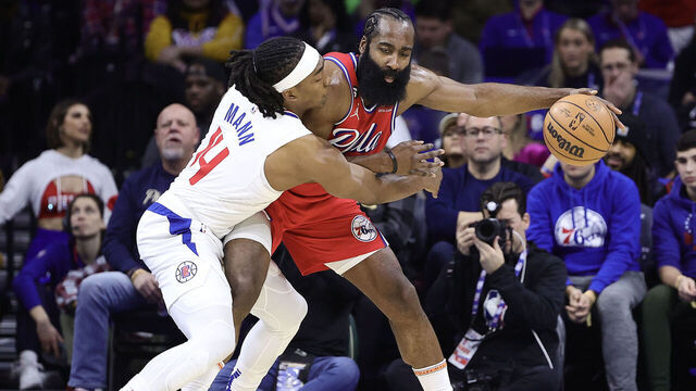 PHILADELPHIA, PENNSYLVANIA - DECEMBER 23: Terance Mann #14 of the LA Clippers guards James Harden #1 of the Philadelphia 76ers during the second quarter at Wells Fargo Center on December 23, 2022 in Philadelphia, Pennsylvania.