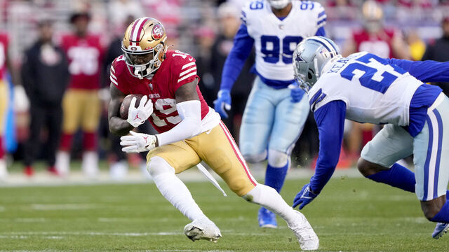 SANTA CLARA, CALIFORNIA - JANUARY 22: Deebo Samuel #19 of the San Francisco 49ers carries the ball against the Dallas Cowboys during the second quarter in the NFC Divisional Playoff game at Levi's Stadium on January 22, 2023 in Santa Clara, California.