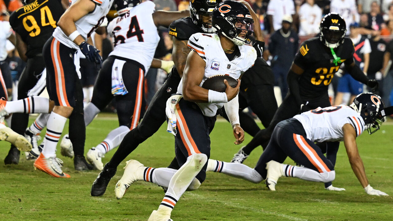 Travis Homer runs through, around and past the Chicago defense