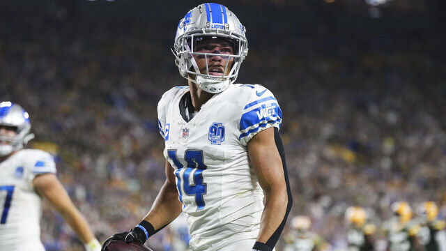GREEN BAY, WI - SEPTEMBER 28: Amon-Ra St. Brown #14 of the Detroit Lions celebrates after scoring a touchdown during an NFL football game at Lambeau Field on September 28, 2023 in Green Bay, Wisconsin.