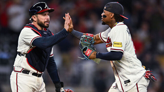 ATLANTA, GA - SEPTEMBER 19: Travis d'Arnaud #16 and Ronald Acuna Jr. #13 of the Atlanta Braves celebrate after winning against the Philadelphia Phillies at Truist Park on Tuesday, September 19, 2023 in Atlanta, Georgia.