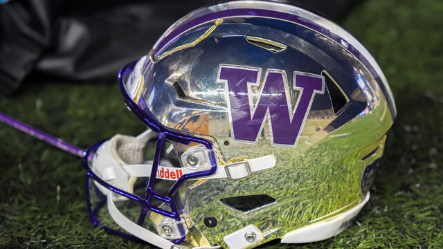 BERKELEY, CA - OCTOBER 22: The sidelines reflected off of the chrome and purple helmet sported by the Washington Huskies at the game between the Washington Huskies and the Cal Bears on Saturday, October 22, 2022 at Memorial Stadium in Berkeley, California.