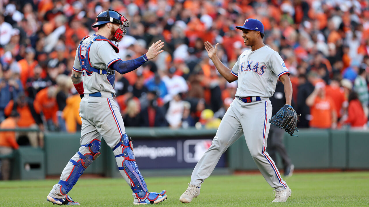 BALTIMORE, MD - OCTOBER 07: Jonah Heim #28 and José Leclerc #25 of the Texas Rangers celebrate after the Rangers defeated the Baltimore Orioles in Game 1 of the Division Seriesat Oriole Park at Camden Yards on Saturday, October 7, 2023 in Baltimore, Maryland.