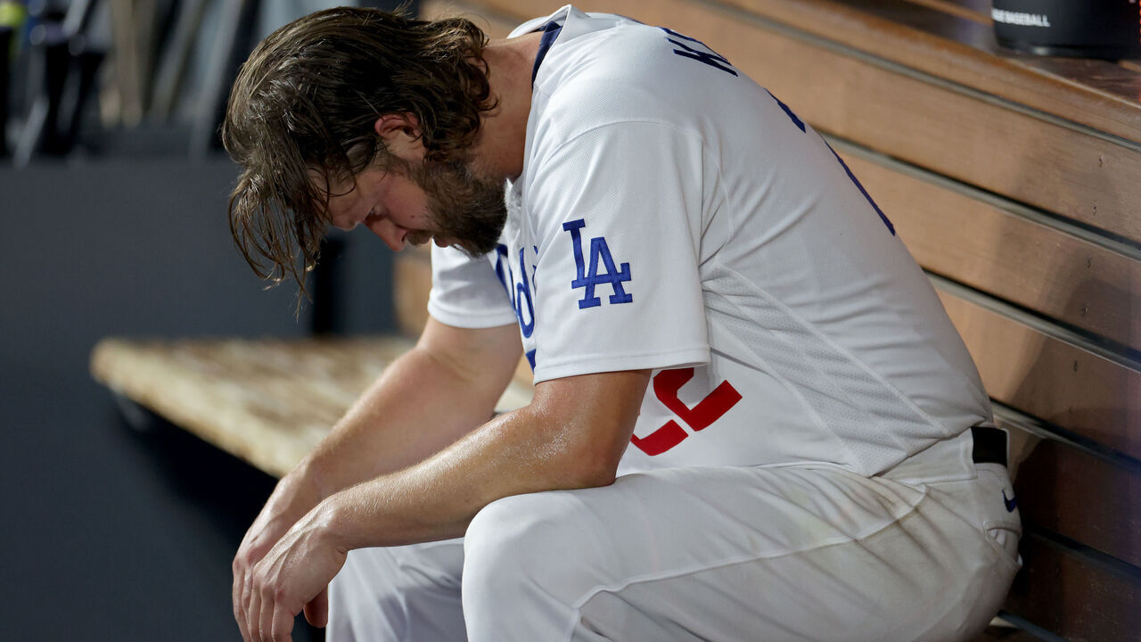 LOS ANGELES, CALIFORNIA - OCTOBER 07: Clayton Kershaw #22 of the Los Angeles Dodgers sits in the dugout after being relieved in the first inning against the Arizona Diamondbacks during Game One of the Division Series at Dodger Stadium on October 07, 2023 in Los Angeles, California.