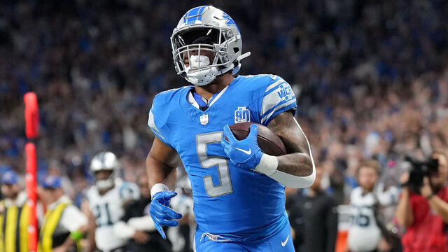 DETROIT, MICHIGAN - OCTOBER 08: David Montgomery #5 of the Detroit Lions scores a touchdown in the first quarter against the Carolina Panthers at Ford Field on October 08, 2023 in Detroit, Michigan.