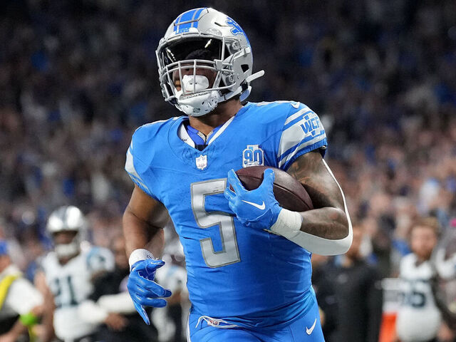 DETROIT, MICHIGAN - OCTOBER 08: David Montgomery #5 of the Detroit Lions scores a touchdown in the first quarter against the Carolina Panthers at Ford Field on October 08, 2023 in Detroit, Michigan.