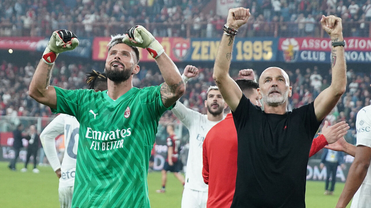 GENOA, ITALY - OCTOBER 7: Olivier Giroud of AC Milan and Stefano Pioli head coach of AC Milan celebrate after winning the Serie A TIM match between Genoa CFC and AC Milan at Stadio Luigi Ferraris on October 7, 2023 in Genoa, Italy.